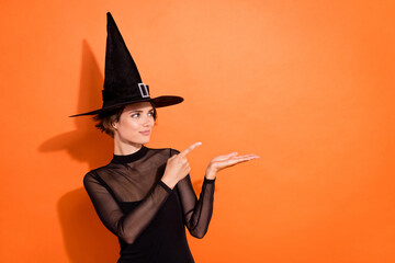 Photo portrait of adorable young woman suggest look empty space dressed trendy black halloween...