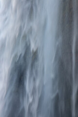 Naklejka na ściany i meble Waterfall person iceland Seljalandsfoss