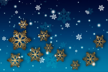 Fototapeta na wymiar Golden and white beautiful snowflakes on a blue Christmas background.