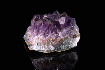 A shard of the raw mineral amethyst with outgrowths of bluish crystals