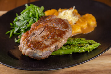 Typical peruvian food, steak with gnocchi