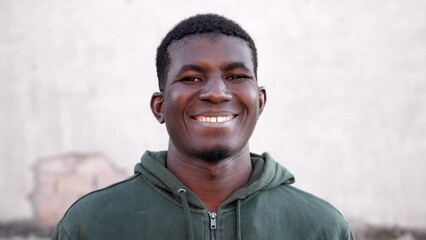 Positivity-young african man looking at camera and smiling