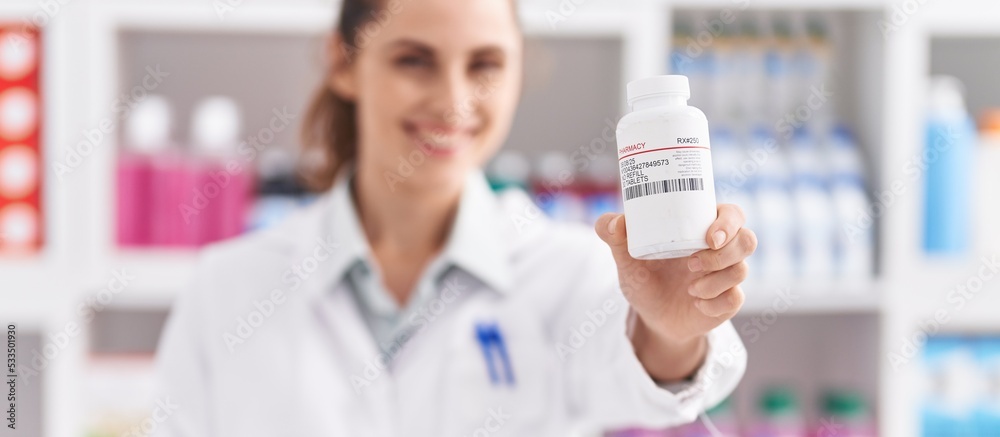 Sticker young woman pharmacist holding pills bottle at pharmacy