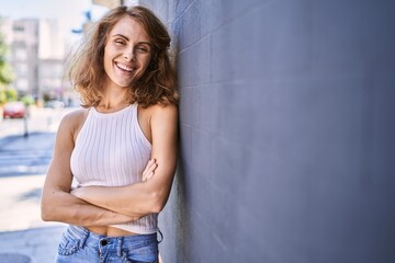 Young caucasian woman smiling confident at street