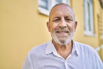 Senior man smiling confident at street