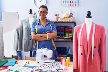 African american woman tailor smiling confident standing with arms crossed gesture at tailor shop