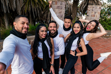 Group of friend at the park taking a photo selfie with same dress code