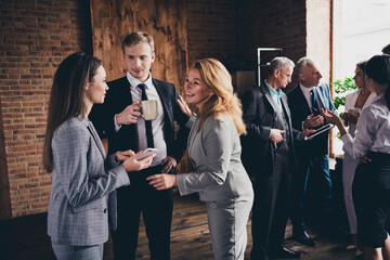 Photo of business people collaboration speak communicate drink fresh coffee spacious office indoors