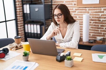 Young woman business worker using laptop working at office