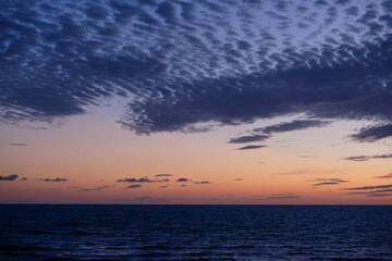 Fototapeta na wymiar Colorful sunset sky cloudscape seascape