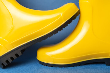 pair of bright yellow rubber boots