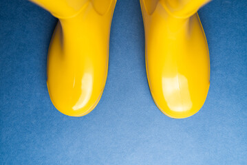 pair of bright yellow rubber boots