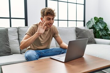 Young caucasian man smiling confident having video call at home