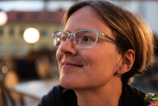 Portrait Of An Attractive Thirty Year Old Smiling  Woman By Night