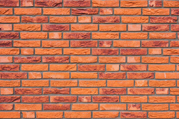 Brick wall as a background. Old brick on a retro house. Abstract composition for the design. Photo for the background.