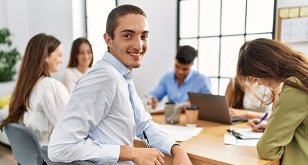 Group of business workers smiling happy working at the office.