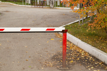 A barrier for car parking. Car parking in the city center.