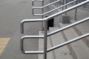 Stainless steel railing.Modern design of railings on the city street.