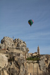 Fototapeta na wymiar Colorful hot air balloon over Matera, Italia