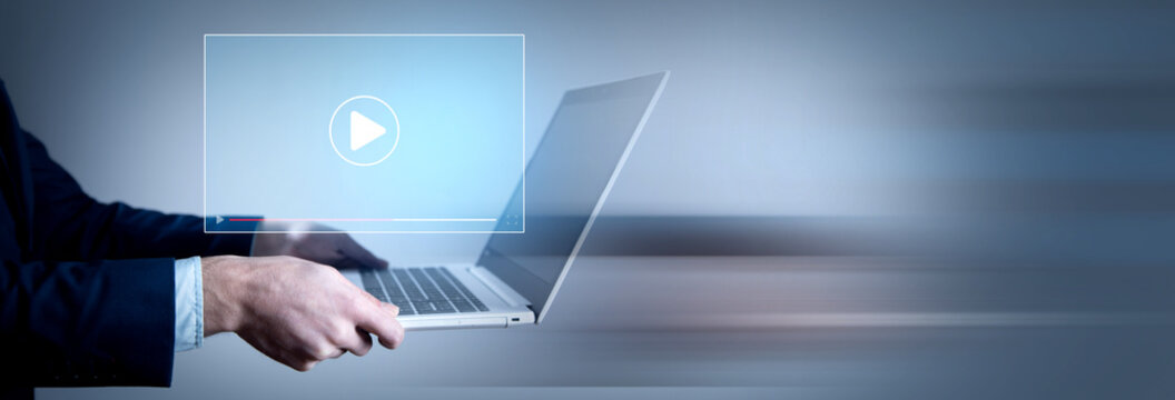 Hands of man using laptop to stream Watch videos