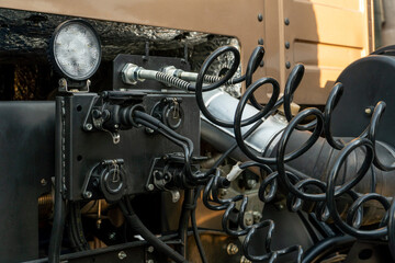 Spiral cable connecting truck cabin and trailer. Pneumatic hoses and electric cables on the coupler of the hitch between a tractor truck and its semi-trailer. Hydraulic control system in new cars.