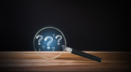 Isolated magnifier and question marks