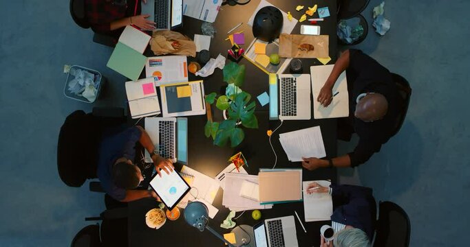 Documents, paper and notebook in office with analytics data team with writing, planning and collaboration. Business meeting, marketing and business people with innovation, creative and strategy plan