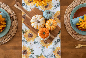 Top view of pretty fall tablescape with colorful pumpkins - 533516943