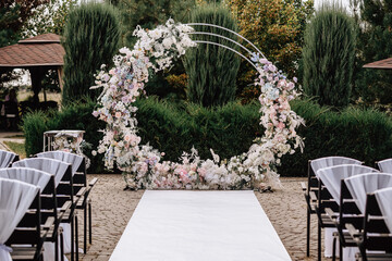 Wedding arch at the ceremony with decor. High quality photo