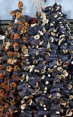 Dried eggplant and dry bell chili hanging in the market.