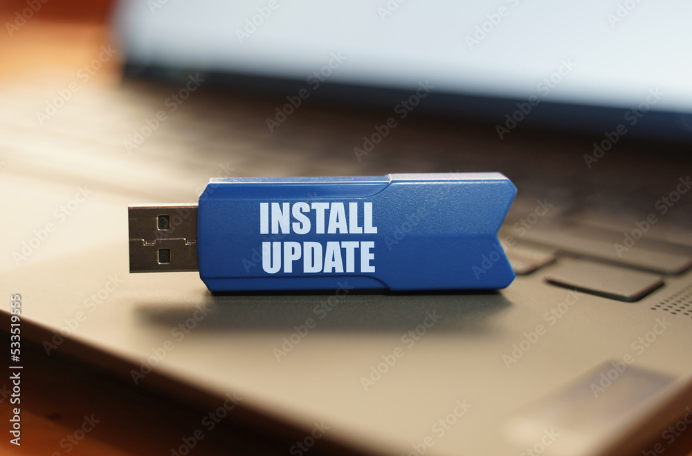 Poster On the laptop keyboard is a flash drive with the inscription - Install Update