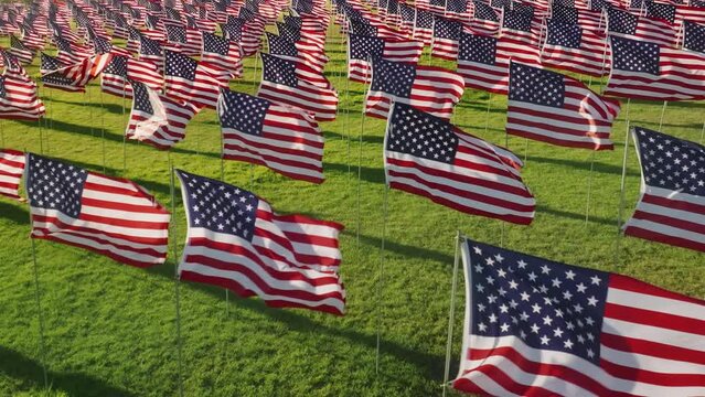 Aerial footage of national flags for each innocent victim of the terrorist attack. Waves of Flags display honoring American and foreign citizens. High quality 4k footage
