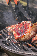 delicious grilled pork steaks on the barbecue