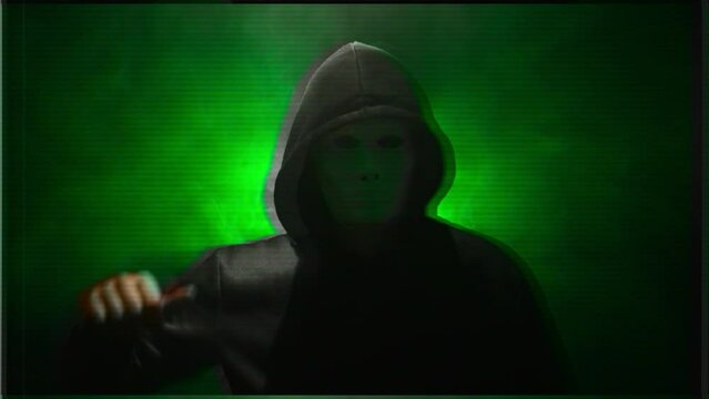 Anonymous in a mask makes an announcement. The effect of the old film.