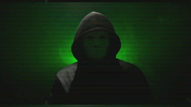 Anonymous in a mask makes an announcement. The effect of the old film.