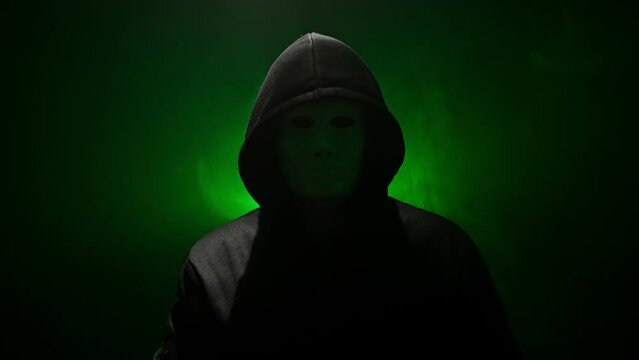 Anonymous in mask makes an announcement.