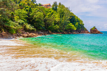 Secret Banana Beach bay panorama turquoise clear water Phuket Thailand.