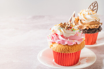 Two Gourmet Cupcakes on a Table