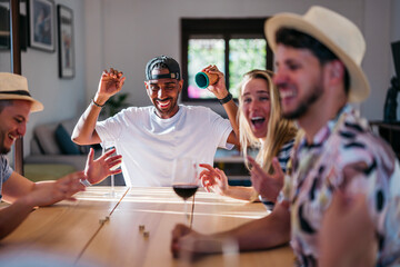 black man happy about the result of a dice roll