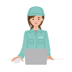 デスクで座ってPCを使っている作業員の女性