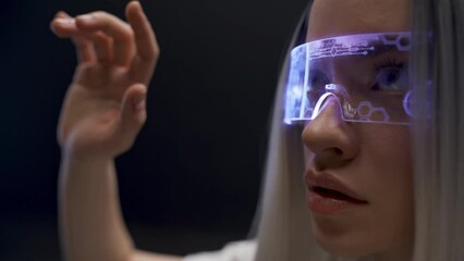 Involved gamer examining virtual reality world closeup. Woman immersed in 3D
