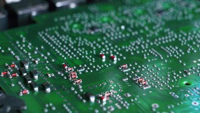 Close up of SFD surface-mount device assembling electrical components on PCB printed circuit board. Modern technology. Horizontal shot . High quality 4k footage