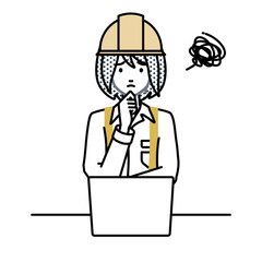 デスクで座ってPCを開いて困っている工事現場の女性