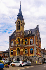 Fototapeta na wymiar Urban summer landscape with a view of the Hotel de Ville in the city of Rochefort, Belgium