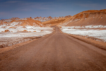 Fototapeta na wymiar Dirt road in Atacama desert, moon valley landscape in Chile, South America
