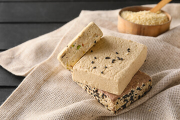 Tasty sesame halva on wooden table, closeup