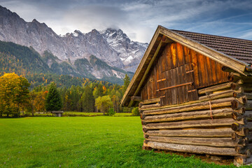 Bavarian alps autumn and wooden barn at sunset, Garmisch Partenkirchen, Germany