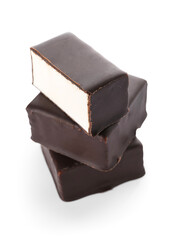 Stack of tasty bird's milk candies on white background