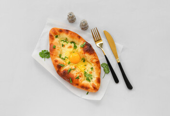 Delicious Ajarian khachapuri isolated on white background