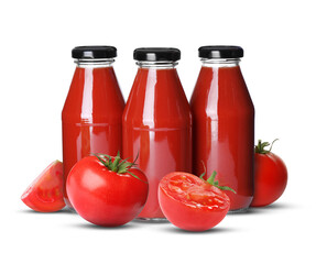 Fresh tomatoes and bottles with juice on white background
